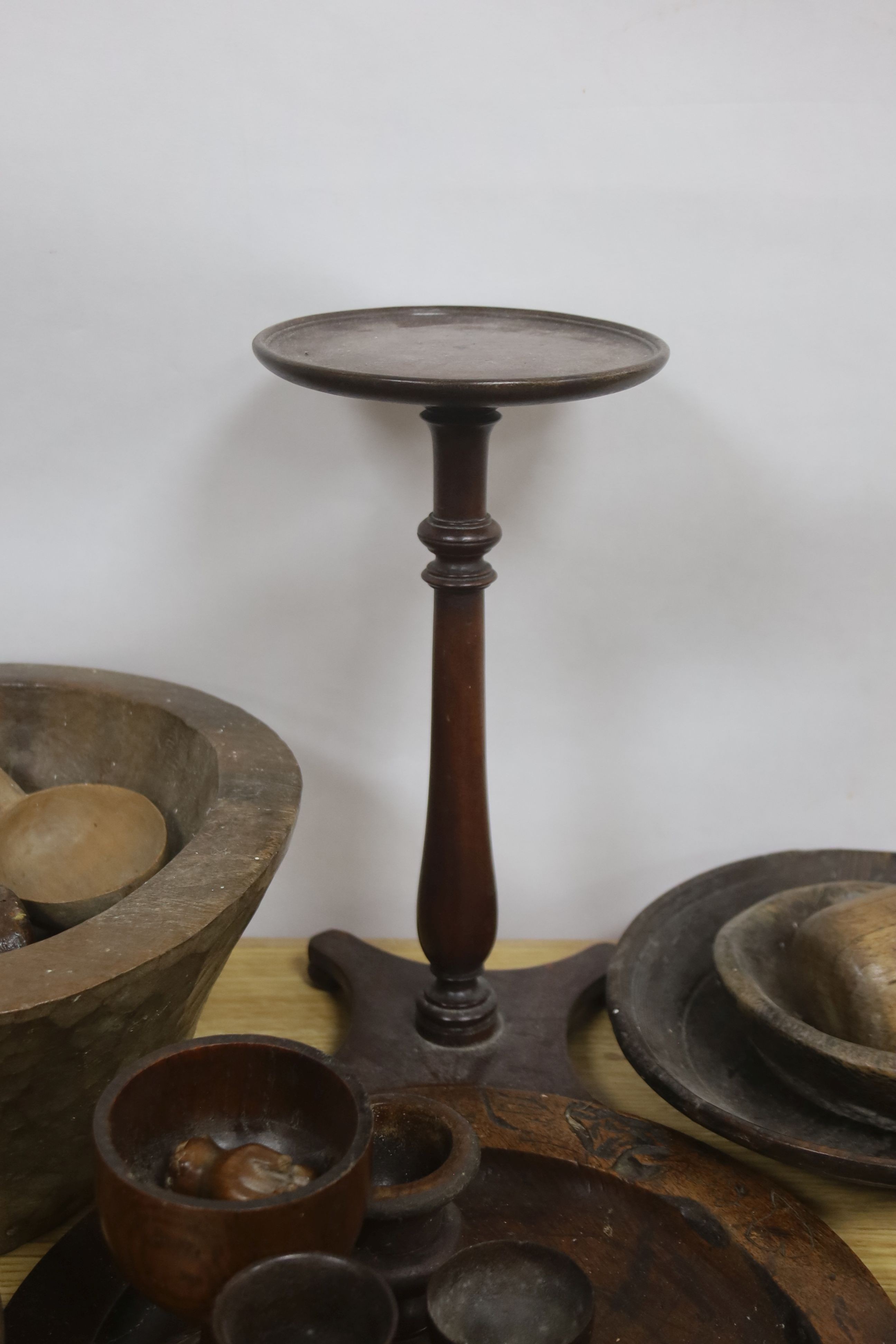 A group of assorted treen including an 18th century sliding lid mahogany box, a candle stand and various goblets etc.